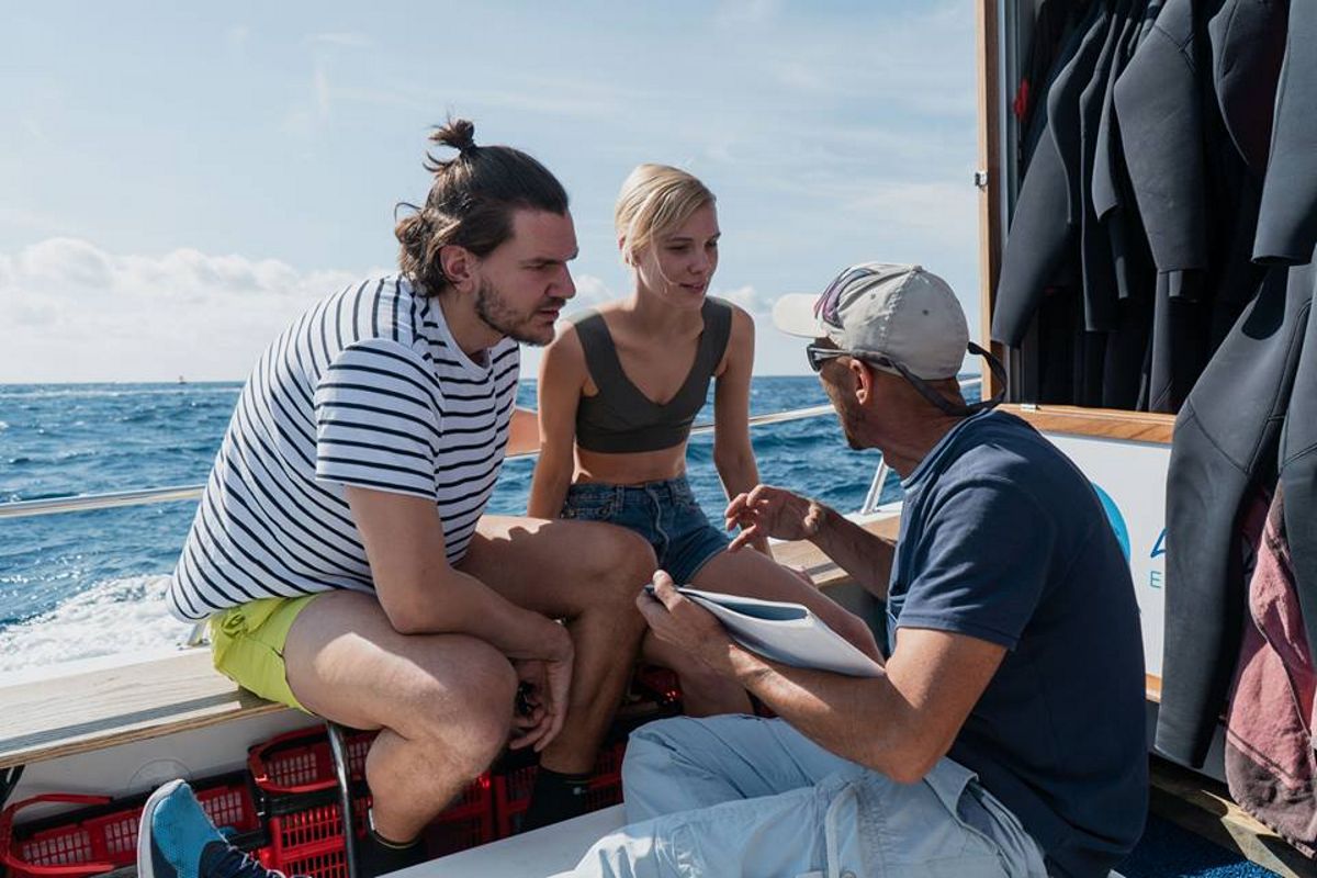 People chatting on a boat, off the coast of Tenerife.