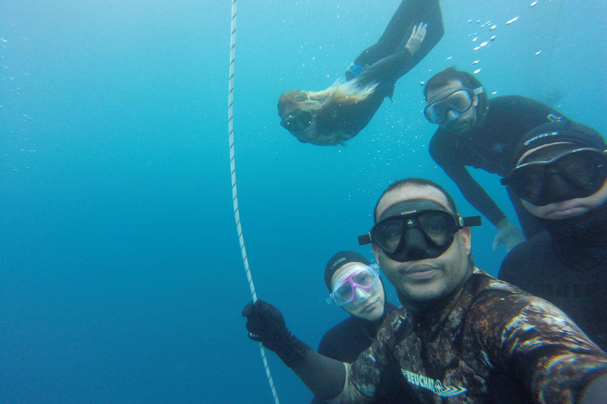 People diving with snorkeling equipment in the waters of Tenerife.