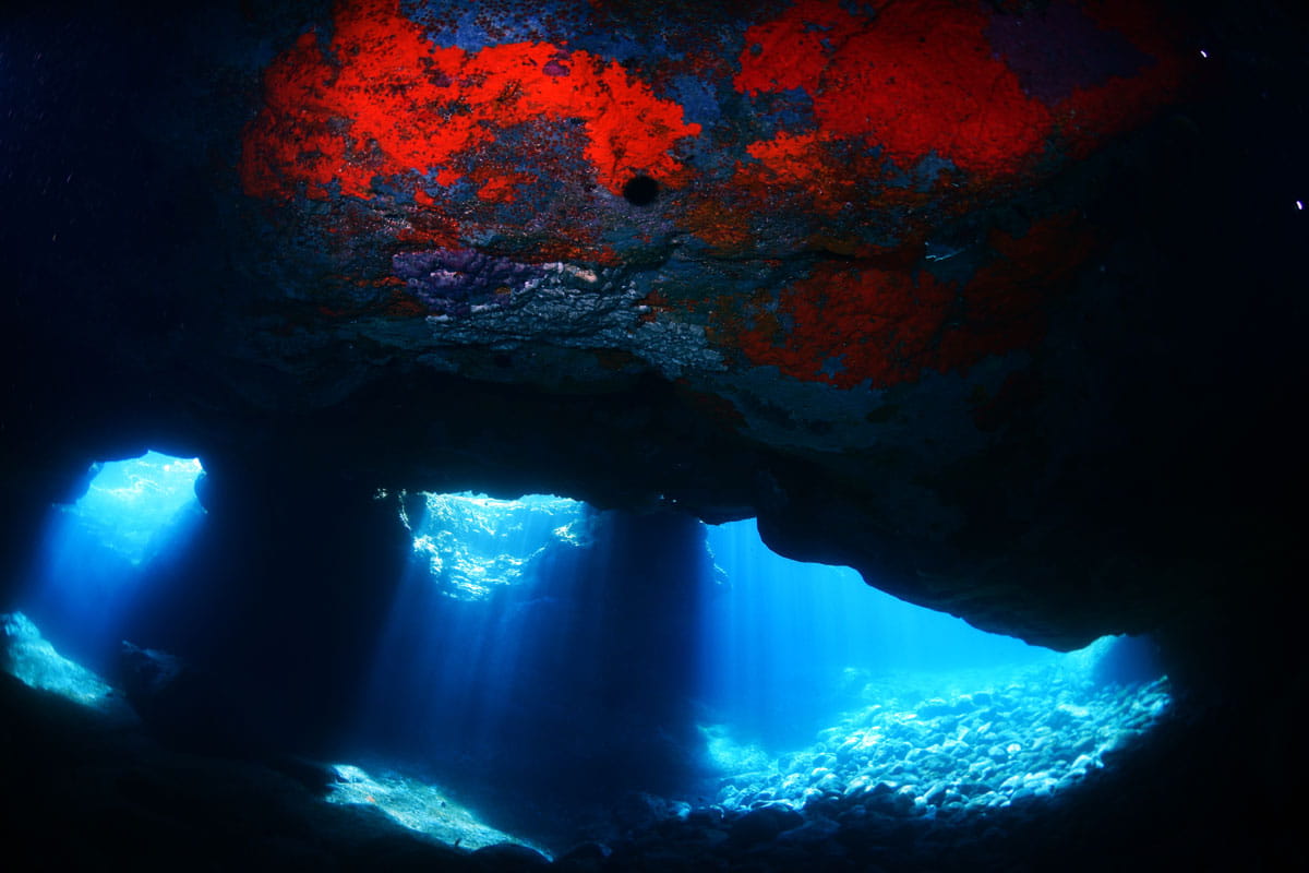 Underwater cave illuminated by sunlight in Tenerife.