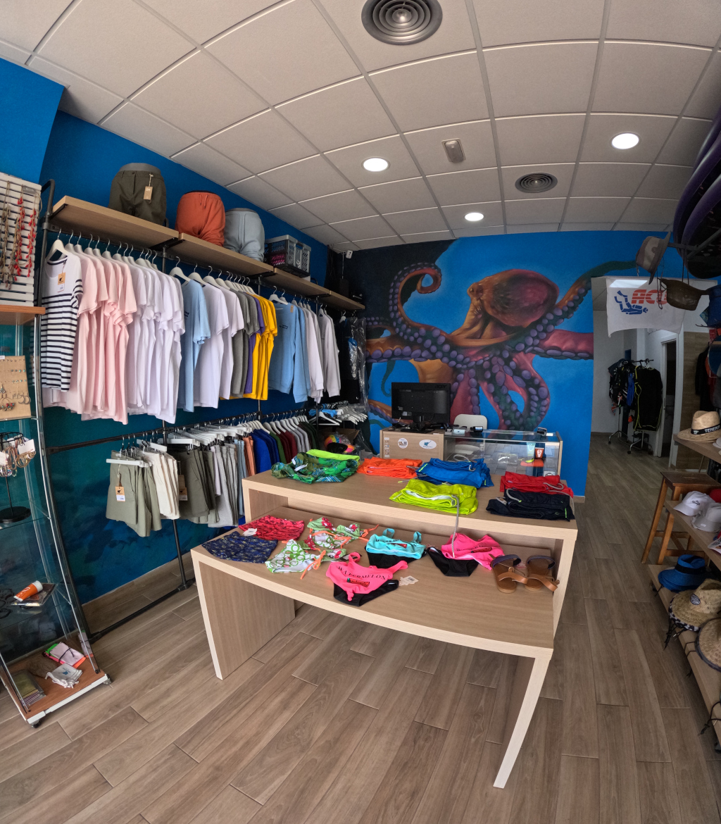 Clothing store with t-shirts and pants on display in Tenerife.