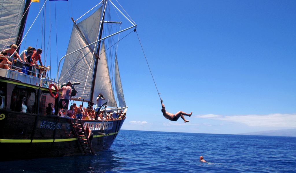 Person jumps from tourist boat to the sea on the coast of Tenerife.