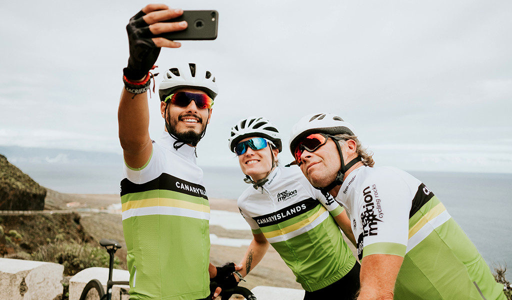 Cyclists taking a selfie on a mountain road in Tenerife.