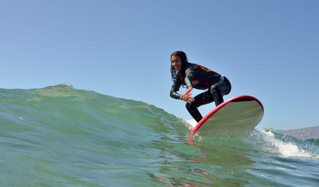 Surfer riding a wave in the waters of Tenerife.