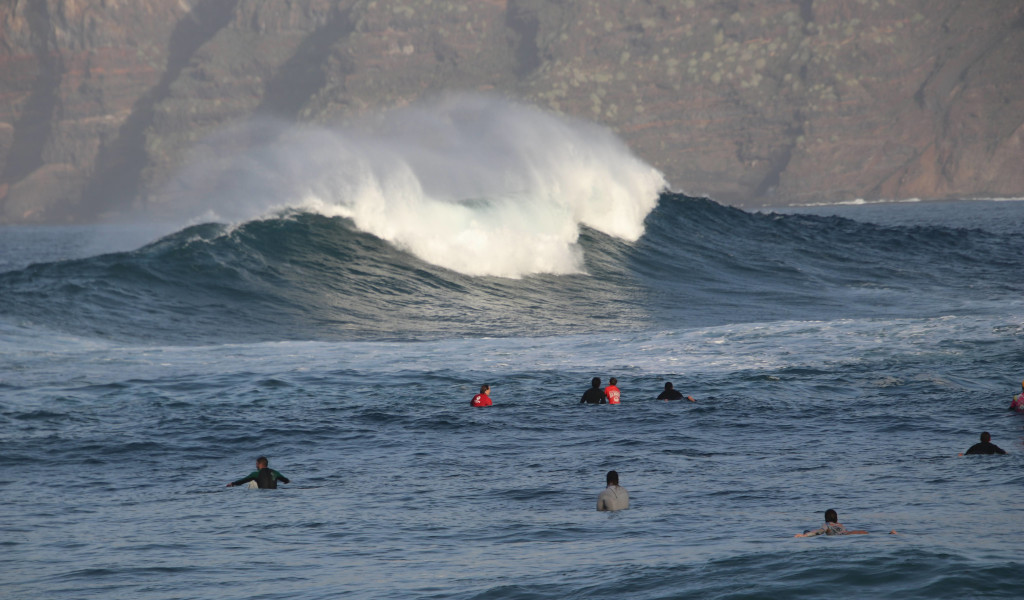 Surfers waiting for a big wave in Garachico, Tenerife.