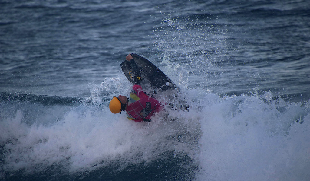 Surfer doing acrobatics in the water in Tenerife.