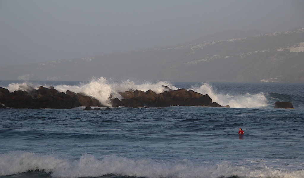 Waves crashing against rocks in the sea in Puerto de la Cruz, Tenerife.