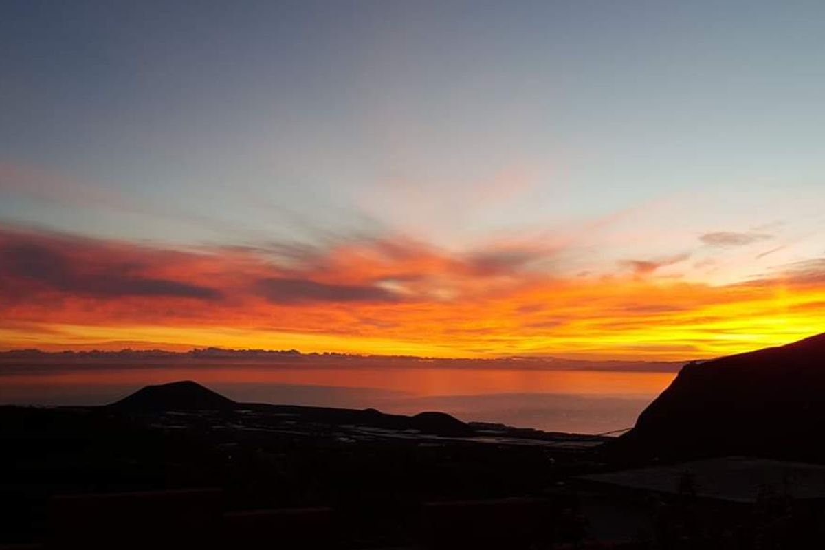 Sunset with orange skies and mountains in Tenerife.