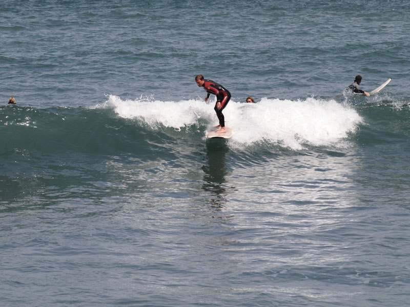 Surfer riding a wave in the sea of Tenerife.