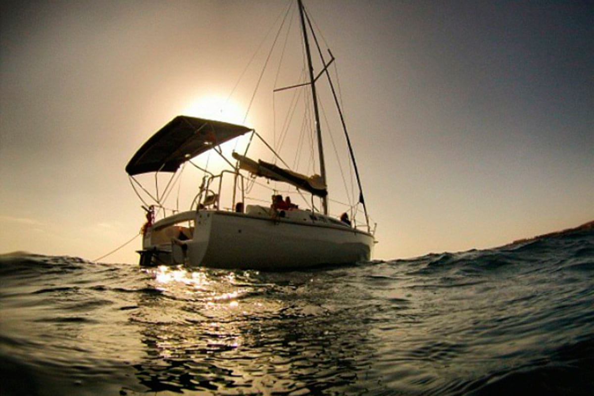 Sailboat at sea at sunset near Tenerife.
