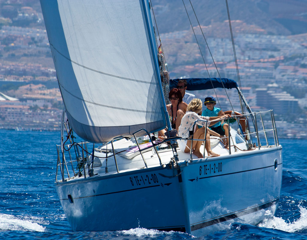 People sailing on a sailboat off the coast of Tenerife.