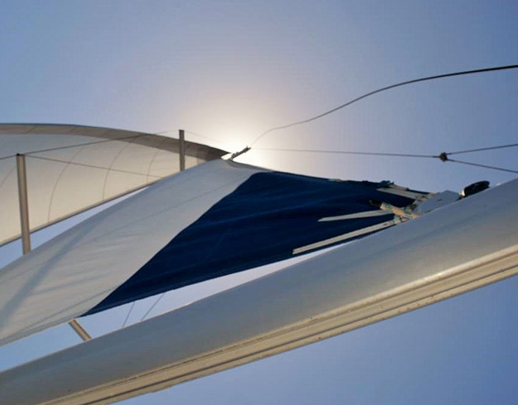 Boat sail sailing in the clear sky of Tenerife.
