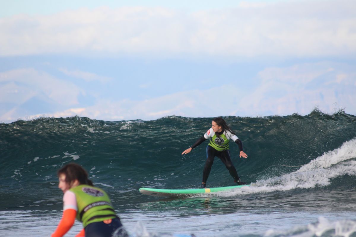 Surfers in action on waves in Tenerife.