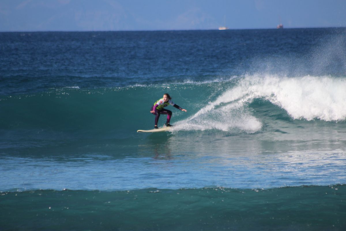 Person surfing on a wave in Tenerife.