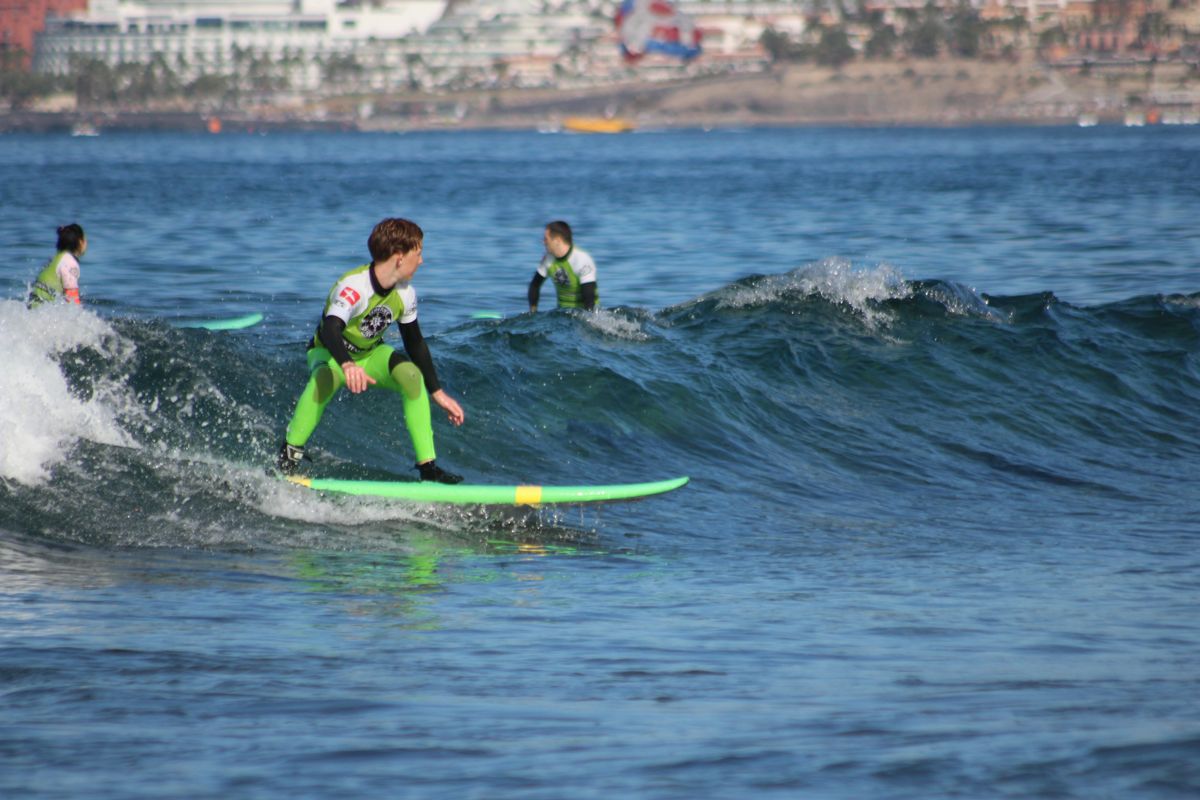 Surfer in action on a wave on the beaches of Tenerife.
