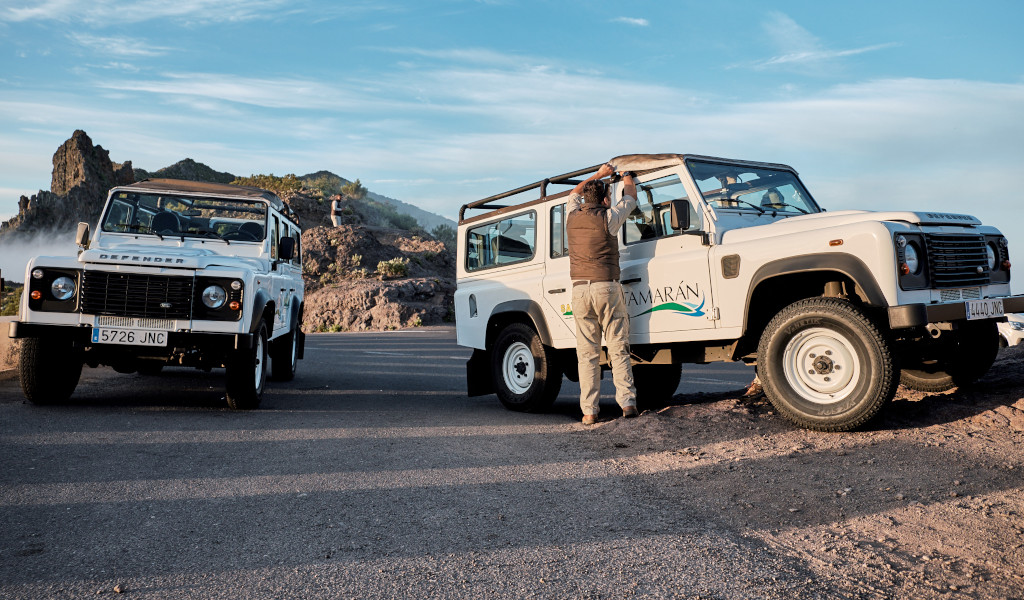 Tamaran off-road vehicles parked in the mountainous landscape of Tenerife.
