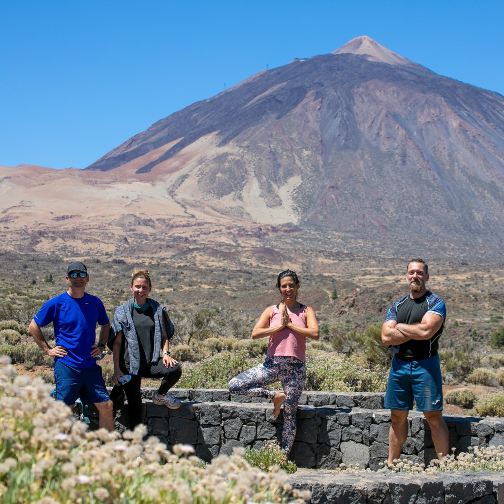 Four people pose in Teide National Park, Tenerife.