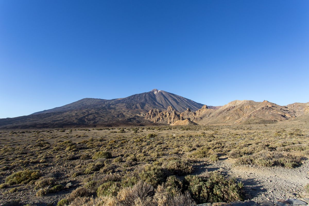 Landscape of Mount Teide in Tenerife with clear skies and mountainous terrain.