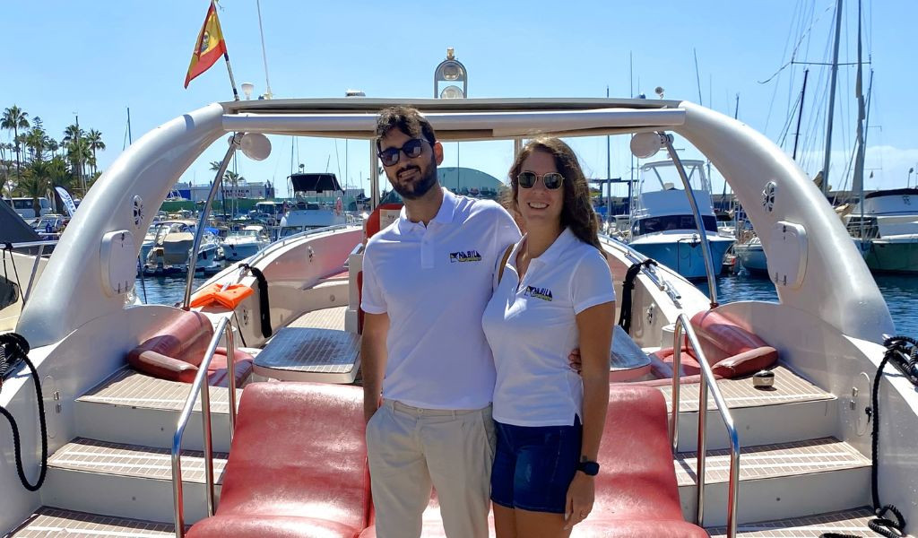 Couple on a yacht in a marina in Tenerife.