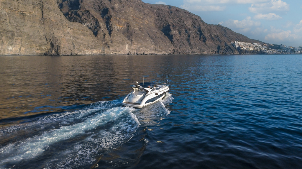 Boat sailing near the Cliffs of Los Gigantes in Tenerife.
