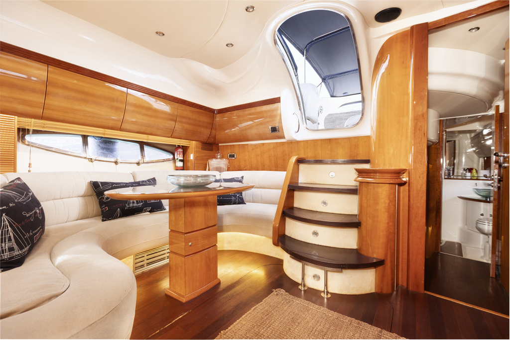 Interior of a yacht in Tenerife with ladder and rest area.