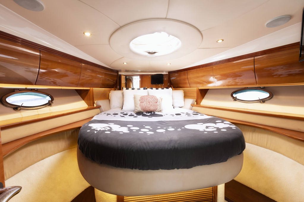 Cabin with round bed and window on a yacht, Puerto de la Cruz, Tenerife.