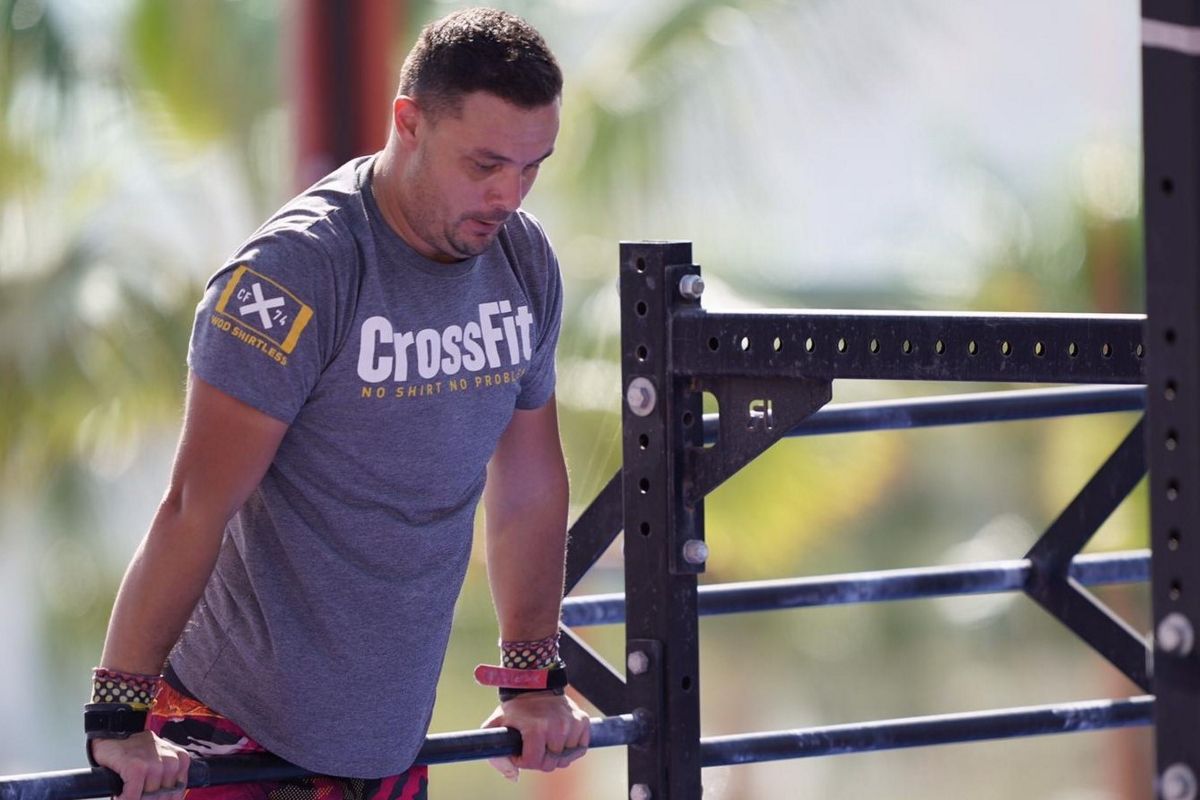 Man doing barre exercise in outdoor gym in Tenerife.