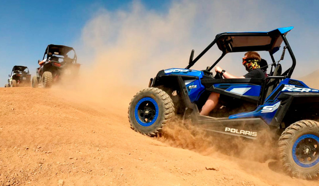 Polaris RZR off-road vehicles on dirt road in Tenerife.
