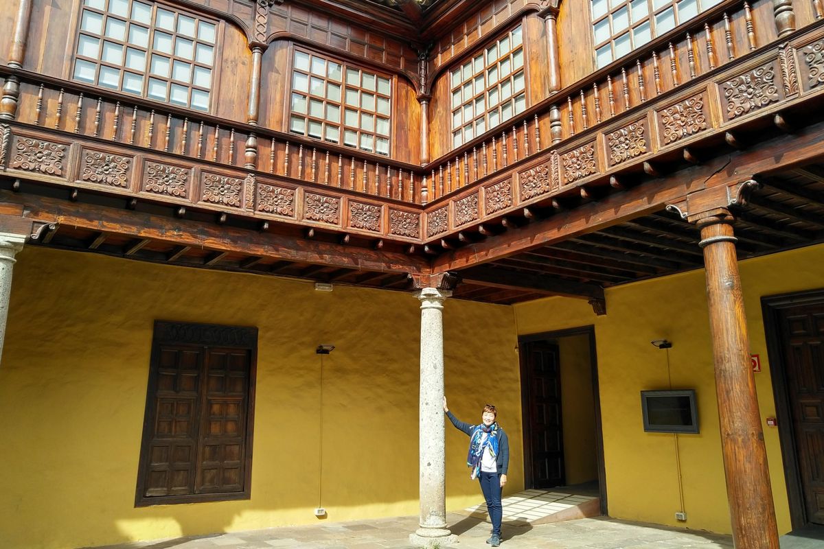 Interior courtyard with columns and carved wood in San Cristóbal de La Laguna, Tenerife.