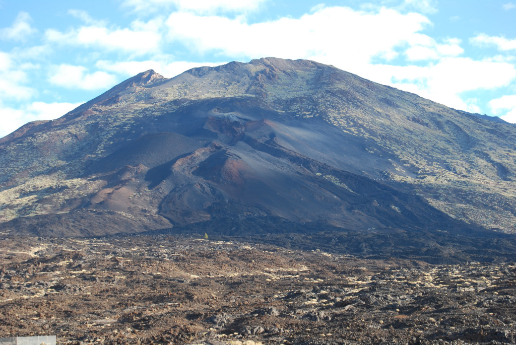 Teide summit in Tenerife, volcanic landscape and blue sky.