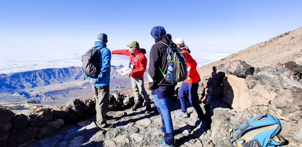 Group tour at the top of Mount Teide, Tenerife, with panoramic views.