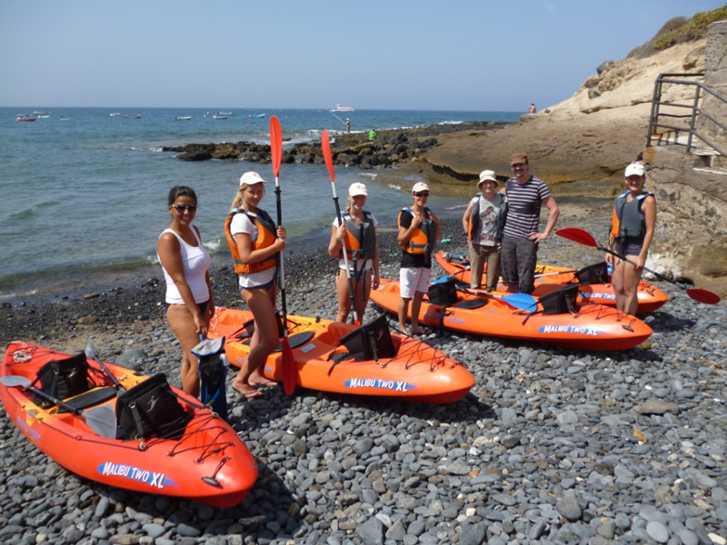 Group with kayaks on the beach in Tenerife, ready for an excursion.
