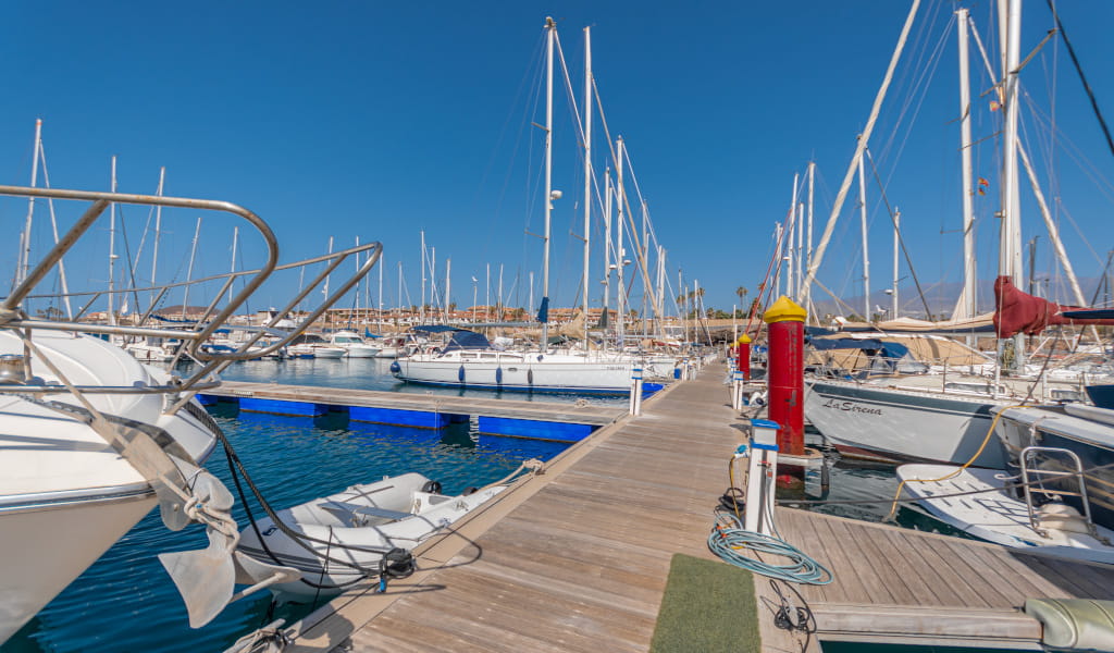 Dock with sailboats docked in the port of Las Galletas, Tenerife.