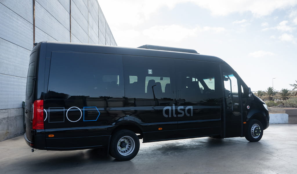 Alsa black minibus parked in Tenerife.