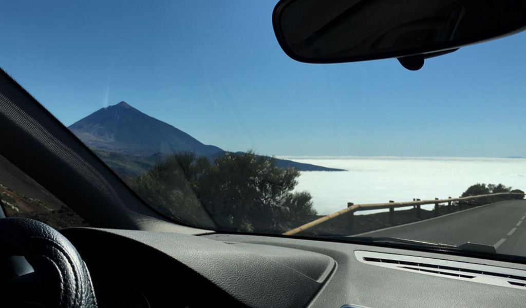 View from a car of the Pico del Teide and the sea of clouds in Tenerife.