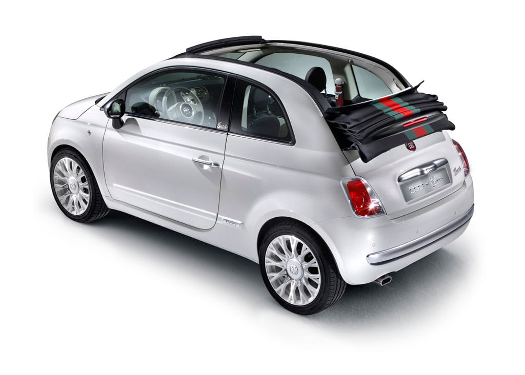 White Fiat 500C car seen from behind with convertible roof.