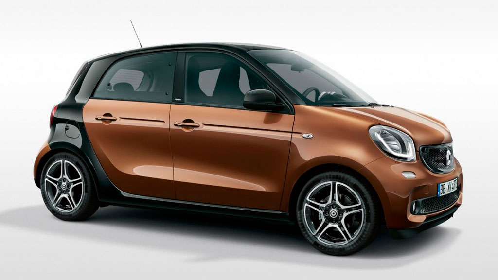 Brown and black compact car parked, seen from the side.