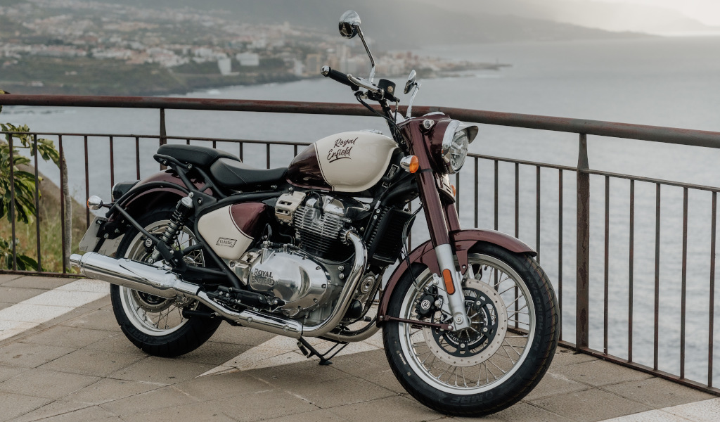 Royal Enfield motorcycle parked with sea view in Tenerife.
