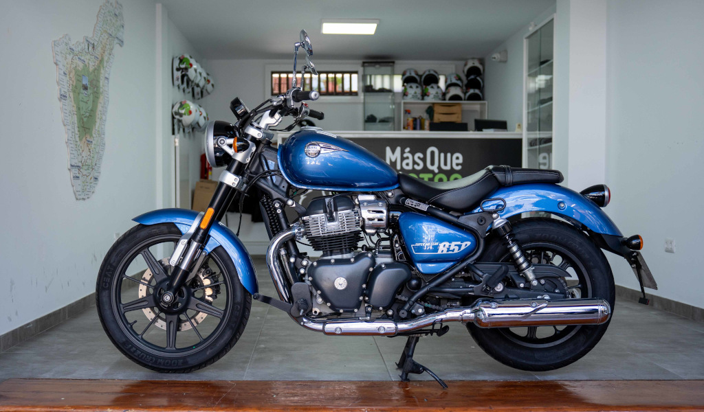 Blue motorcycle model B52 parked inside a store in Tenerife.