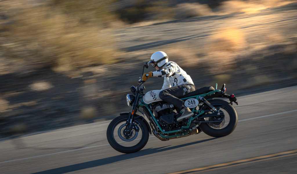 Motorcyclist with a white helmet on the road in Tenerife. Motorcycle number: 249.