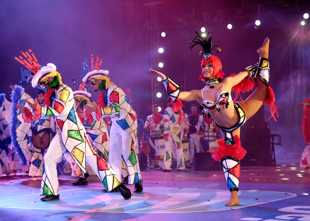 Dancers in colorful costumes performing at the carnival of Tenerife.