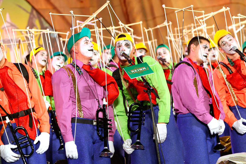 Comparsa with colorful costumes and makeup at the Carnival of Santa Cruz de Tenerife.