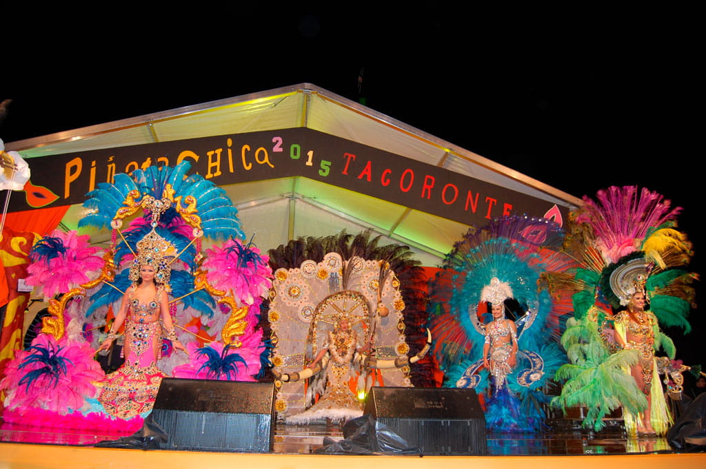People in colorful costumes on a stage of the carnival in Tacoronte 2015.