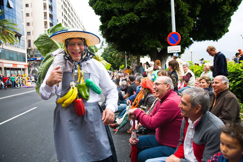 Celebration in Santa Cruz de Tenerife with a man in costume cheering up the audience.