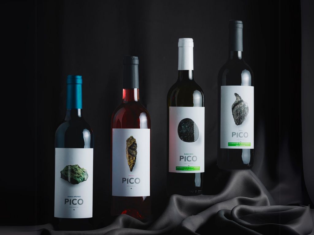 PICO brand wine bottles on a dark background in Tenerife.