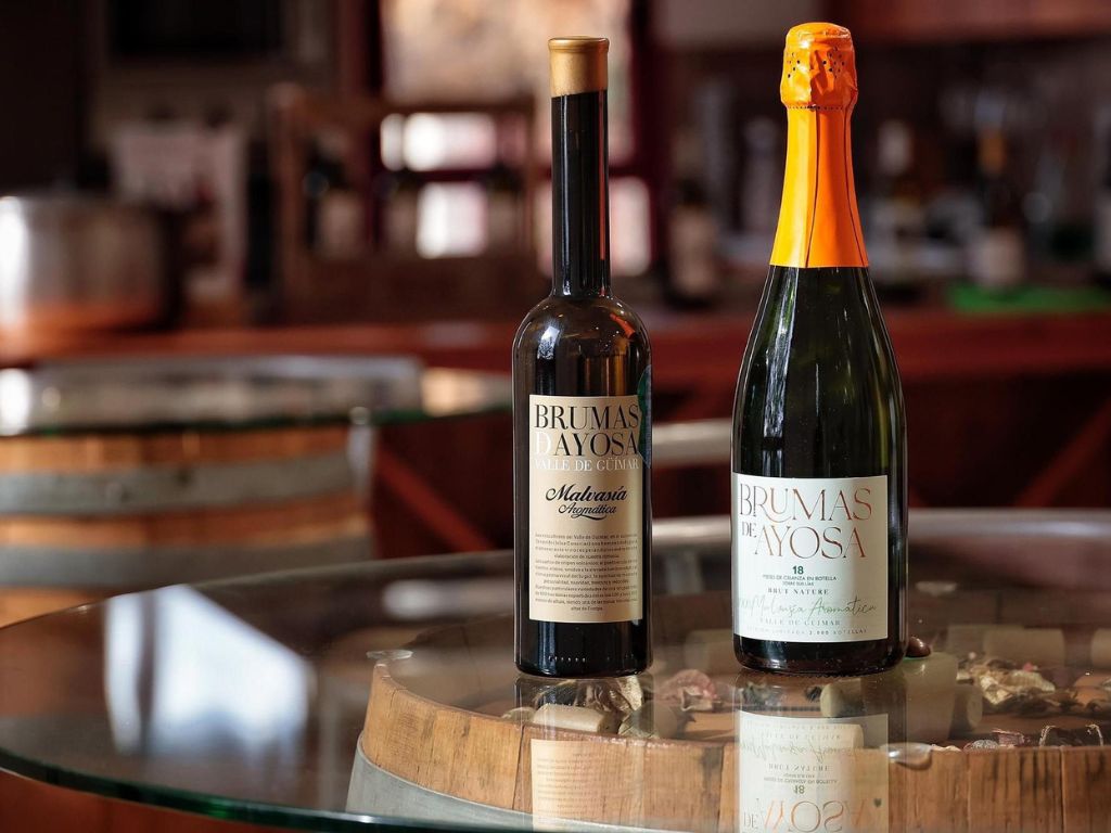 Bottles of Brumas de Ayosa wine on a table in a winery in Güímar, Tenerife.