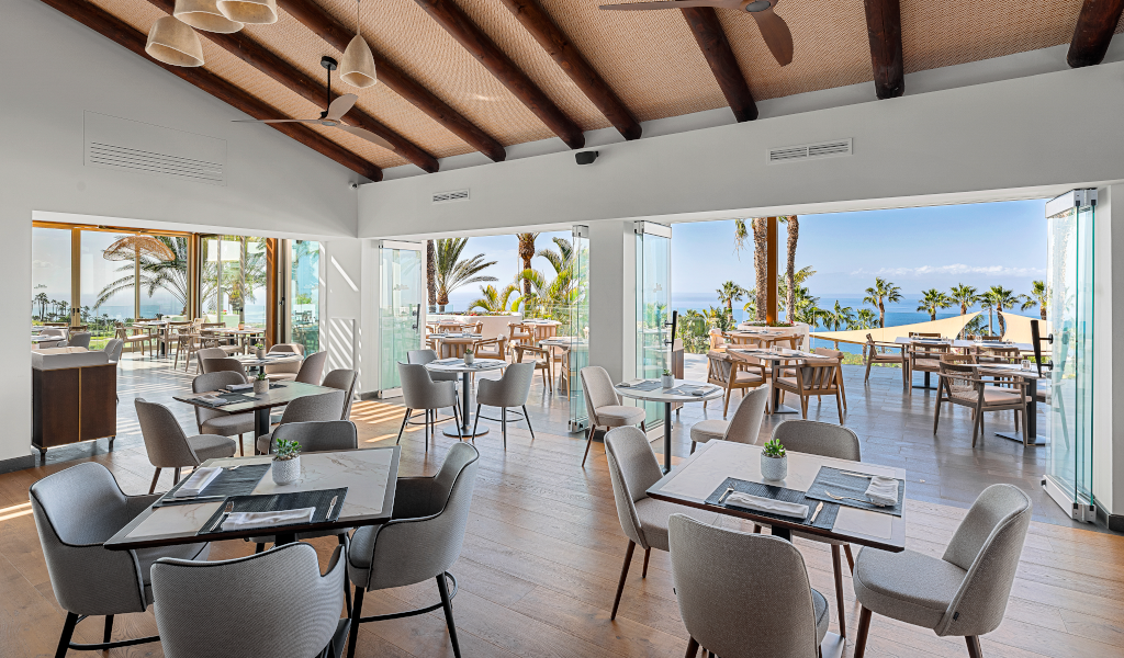 Restaurant with sea views and palm trees in Tenerife.