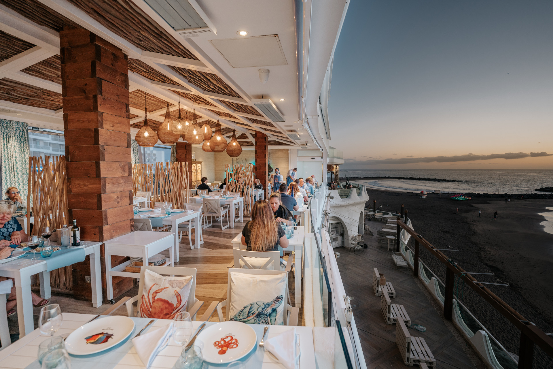 Restaurant terrace with sea view at sunset in Tenerife.