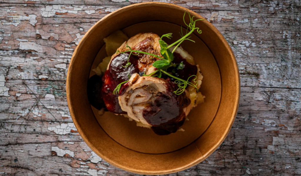 Meat dish with puree and sauce in cardboard container, Tenerife.