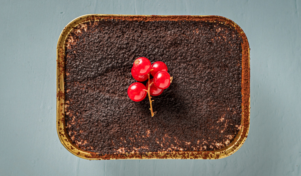 Chocolate dessert with red currants on the table in Tenerife.