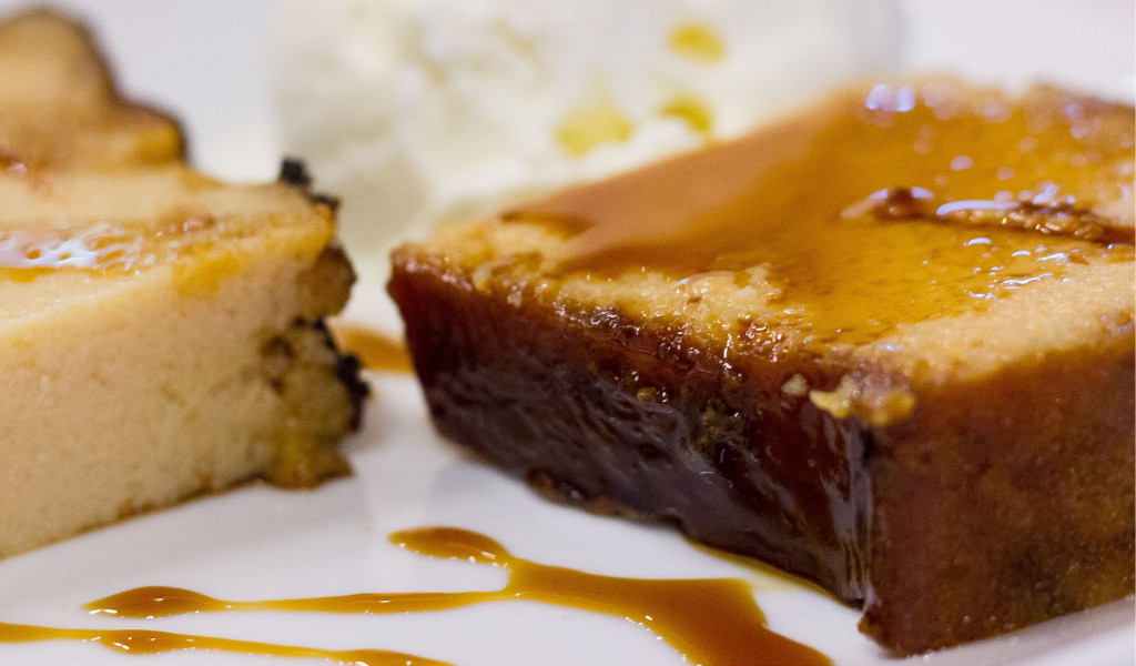 Flan with caramel and cream on a plate, a typical dessert from Tenerife.